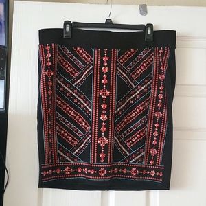 Torrid skirt with embroidery detail on the front.